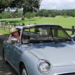 Carla Perry sat in her Nissan Figaro