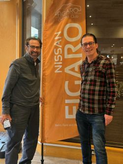 Michael and Adam stood by Figaro Owners Club flag