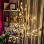 a white christmas tree with decorations and lights
