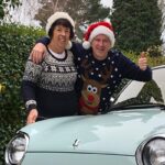 Kevin and Sue stood by their car Belle with the words "Thank You Kevin and Sue" written across the image