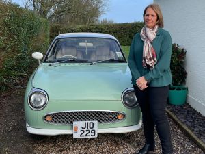 Caroline Parry standing by her Figaro