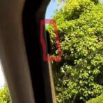 an image showing where the tab is that can help reduce wind noise in the cabin