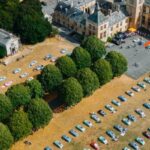 many Nissan Figaros parked outside Walton Hall
