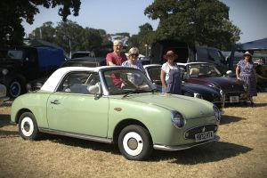 Members stood by their Figaros at the event