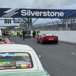 Fergus the Figaro lined up with other cars on the track at CarFest